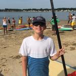 Moms Rock The River young boy with a paddle