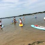 Moms Rock The River paddleboarders out on the water