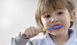 child brushing teeth