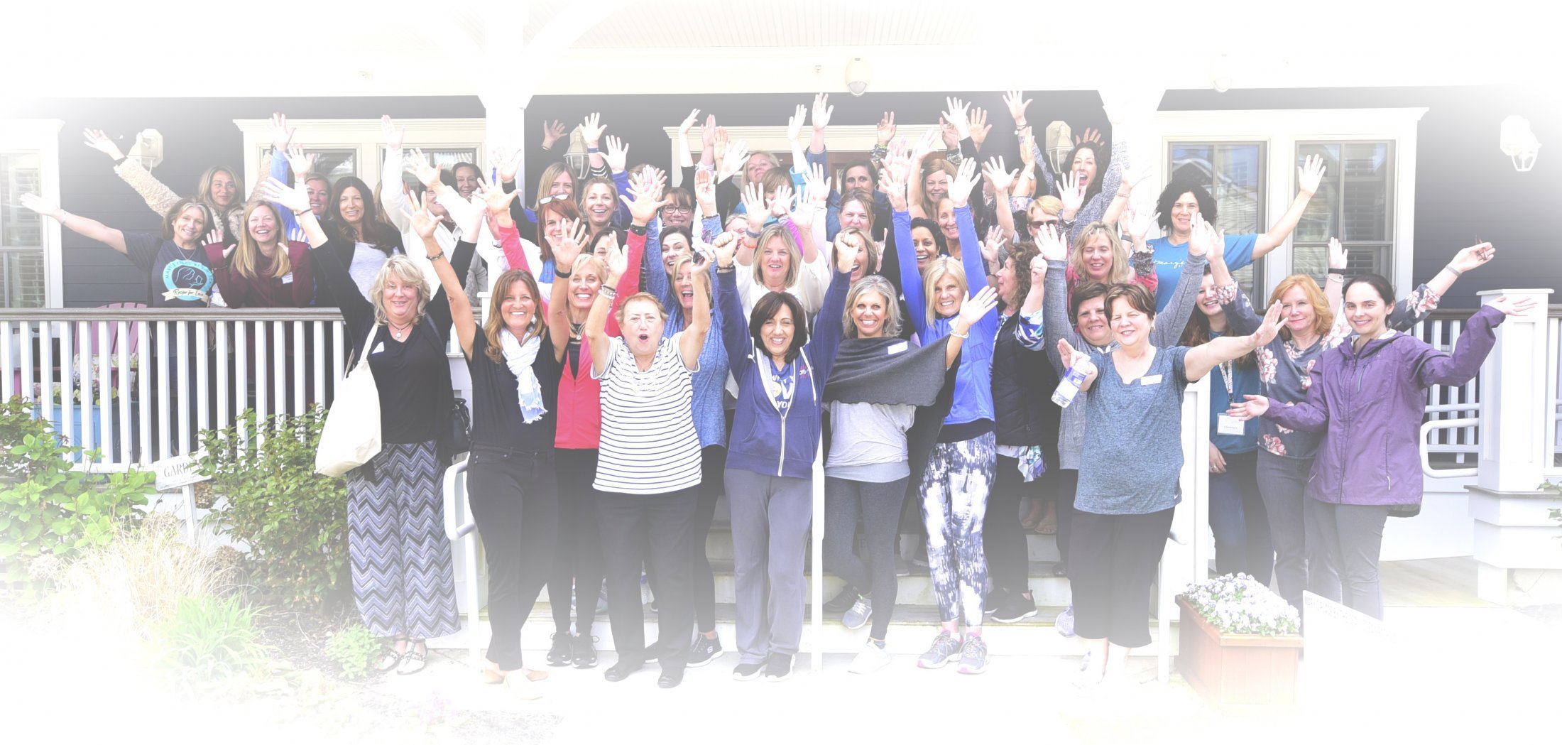 group of people cheering together