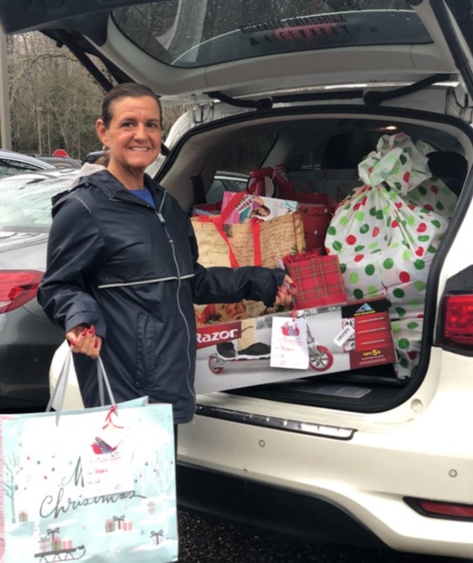 filling the trunk of a car with gifts