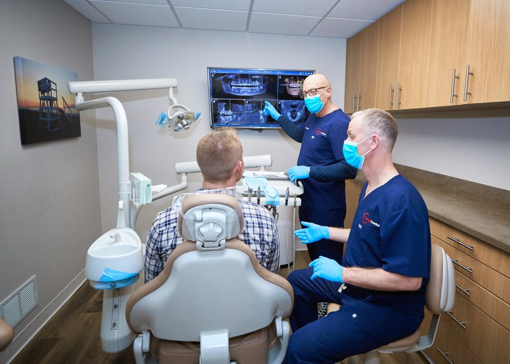 doctors consulting a patient on his x-rays
