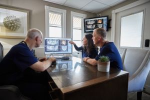 Dentists examining x-rays