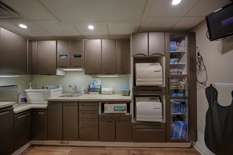 Cabinets neatly packed with dental equipment