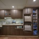 Cabinets neatly packed with dental equipment
