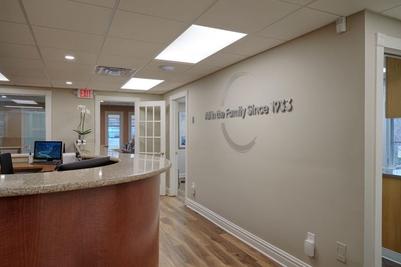 Front desk with logo behind it