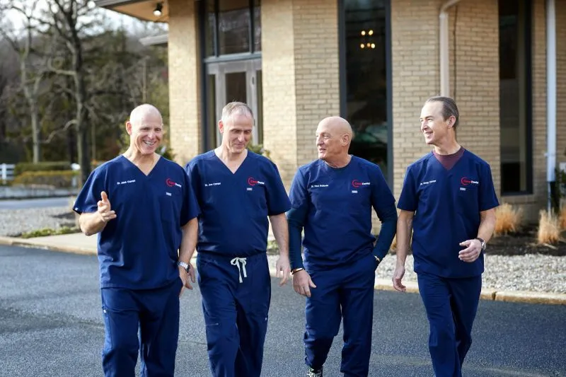 The four doctors walking together