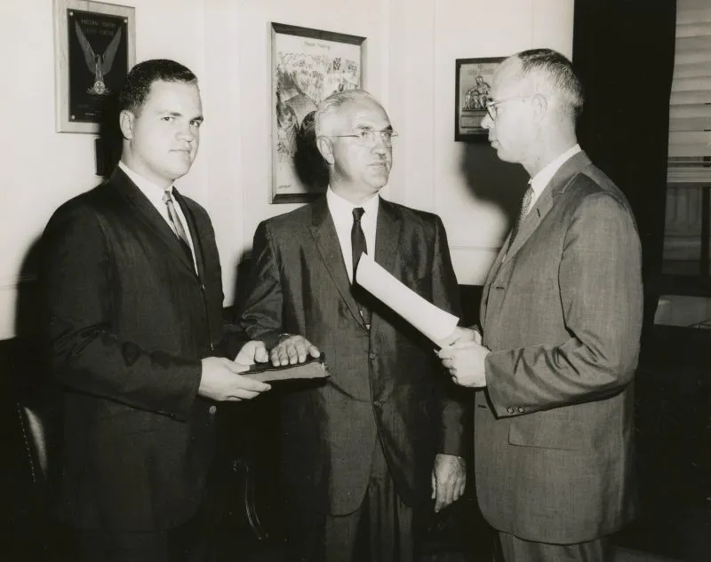 Three gentleman in an old black and white photo